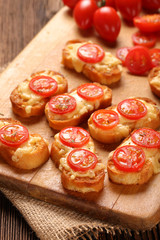Grilled toast with cheese and tomatoes