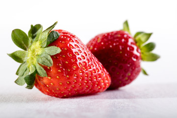 Two juicy strawberry on the table