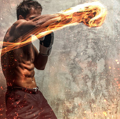 Fighter with naked torso poses in studio.