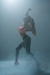 Skillful female dancer is performing passionate movements