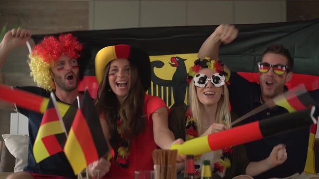 german fans cheering for Germany
