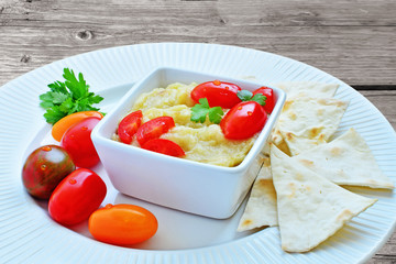 Eggplant dip with pita bread and cherry tomatoes