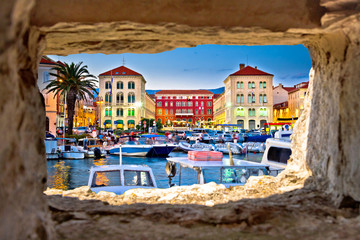 Prokurative square in Split through stone window - obrazy, fototapety, plakaty
