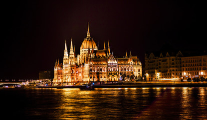 Fototapeta na wymiar Parliament Building Boats Danube River Night Budapest Hungary