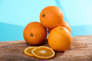 Heap of oranges and oranges slices