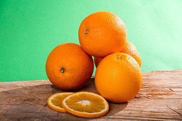 Heap of oranges and oranges slices