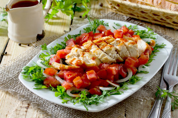 Salad of grilled chicken with leafy vegetables, watercress salad