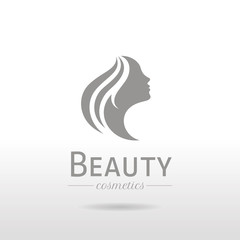 Elegant luxury logo with beautiful face of young adult woman with long hair. Sexy symbol silhouette of head with text lettering