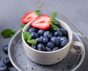 Strawberries and Blueberries on metal background