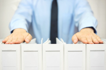 businessman holding documentation in binders, accounting & busin