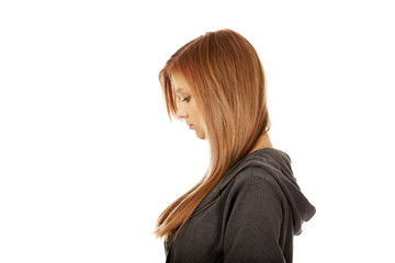 Naklejka premium Sad or worried teenage pretty woman 