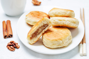 Obraz na płótnie Canvas Korean sweet pancakes with nuts topping. Hotteok