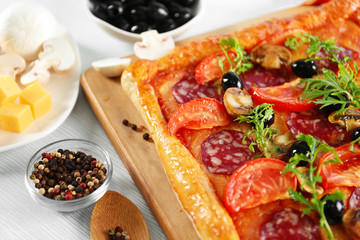 Rectangle delicious pizza on the table, close-up