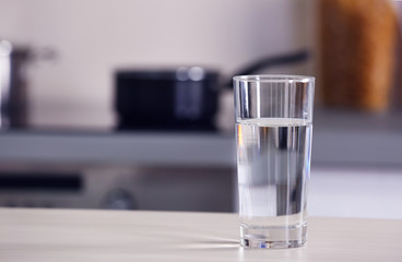 Glass of pure water on kitchen table