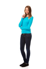 Young woman standing with toothy smile