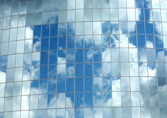 Modern office building with reflection on mirror of wall
