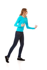 Fototapeta premium Angry teenage woman making fists