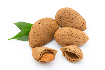 Almonds with leaves isolated on white background