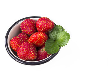 Strawberry in a mug on white background