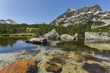 Fototapeta na wymiar Reflection of Dzhangal peak and Banski lakes, Pirin Mountain, Bulgaria
