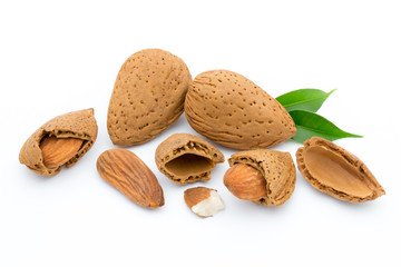 Almonds with leaves isolated on white background