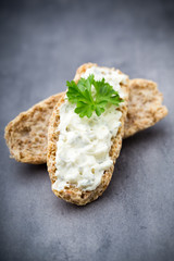Crispbread with soft cheese with herbs and bacon.