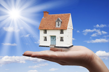 woman hand house