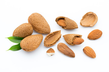 Almonds with leaves isolated on white background