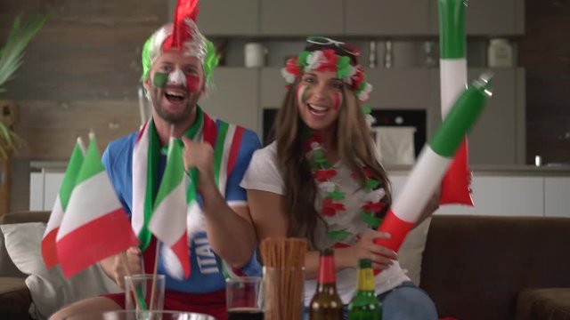 Fan couple cheering for Italy
