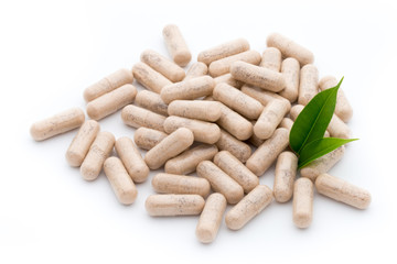 Ginkgo biloba capsule on the white background.
