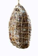 salami hanging on a white