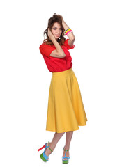 Beautiful woman with curly hair wearing a red jacket, isolated on white background