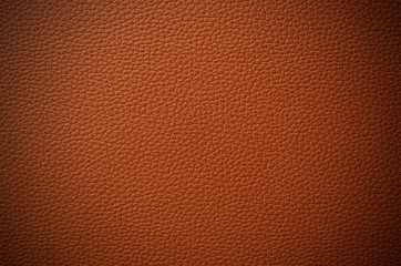 Brown leather skin background with vignette effect