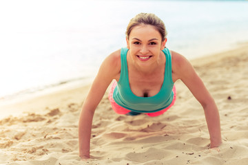 Beautiful sport girl on the beach
