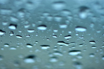Raindrops on glass, selective focus.