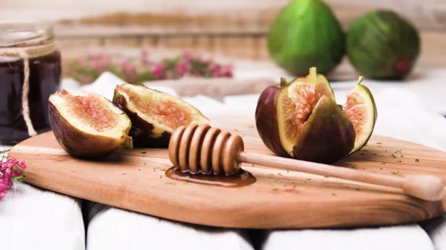 Figs and honey on a wooden table selective focus.