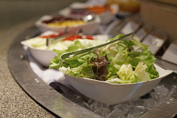 vegetables salad bar on buffet line