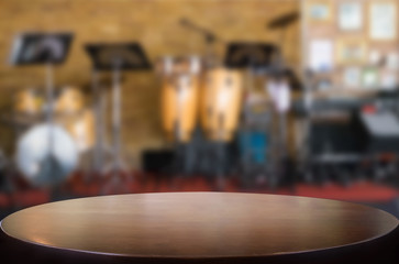 Selected focus empty brown wooden table and Coffee shop blur bac