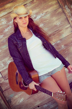 Country Girl Holding Guitar