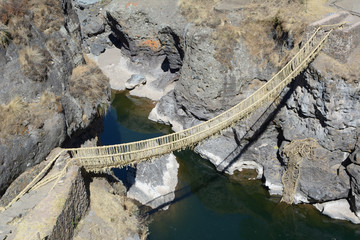 Ancient rustic bulrush sedge suspension bridge  © turventur