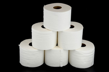 toilet paper rolls on black background