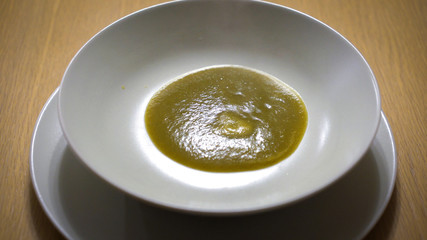 Vegetable soup in a dish.