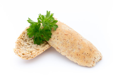 Dry flat bread crisps with herbs on a white background.