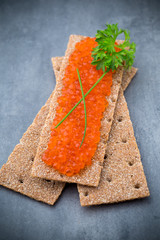 Crispbread with soft cheese with herbs and bacon.