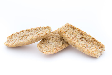 Dry flat bread crisps with herbs on a white background.