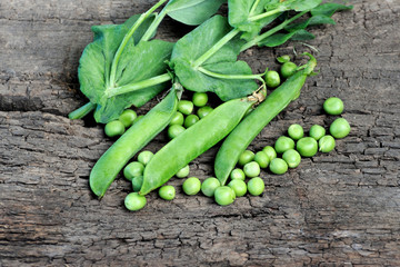 pea pods on wooden table