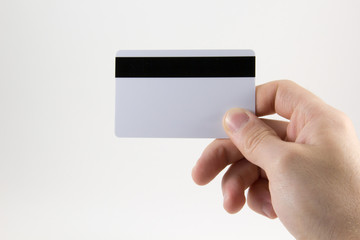 Hand with a credit card on a white background