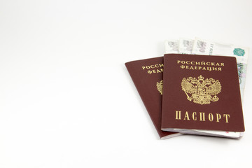The passports of the Russian Federation and money on a white background