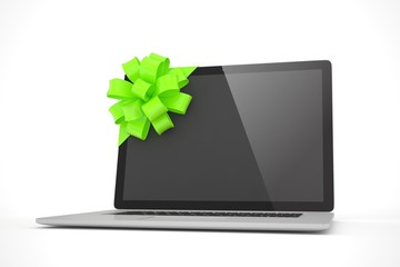Tied laptop with green bow on white background. Modern present or gift for birthday, holiday, christmas. 3D rendering.