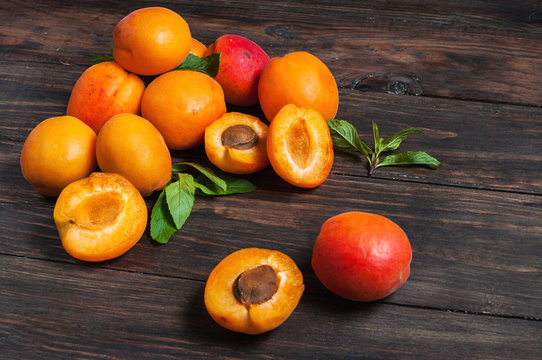 apricots on dark wood background